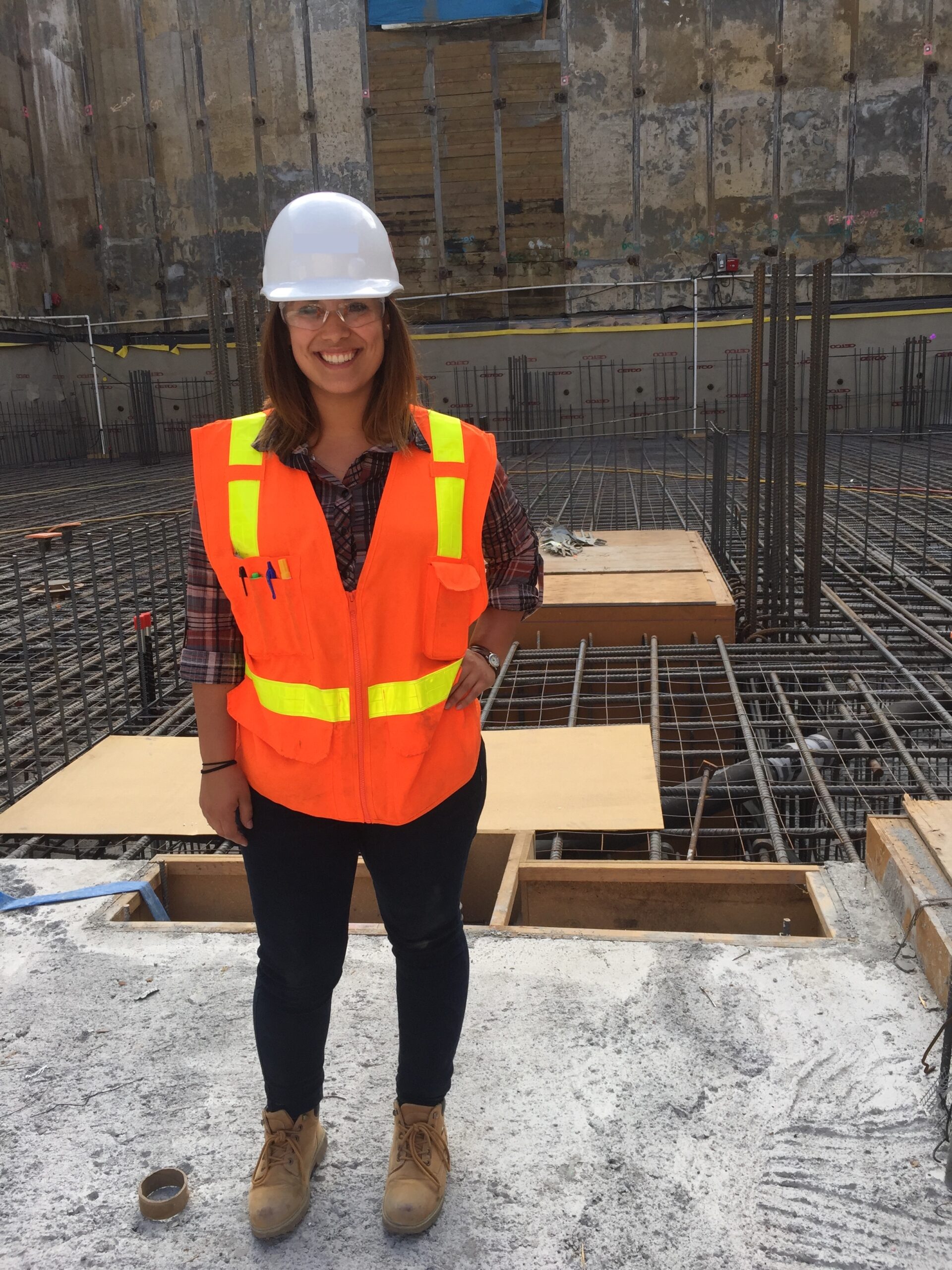 Mascarenas standing at a construction job site with safety gear on.