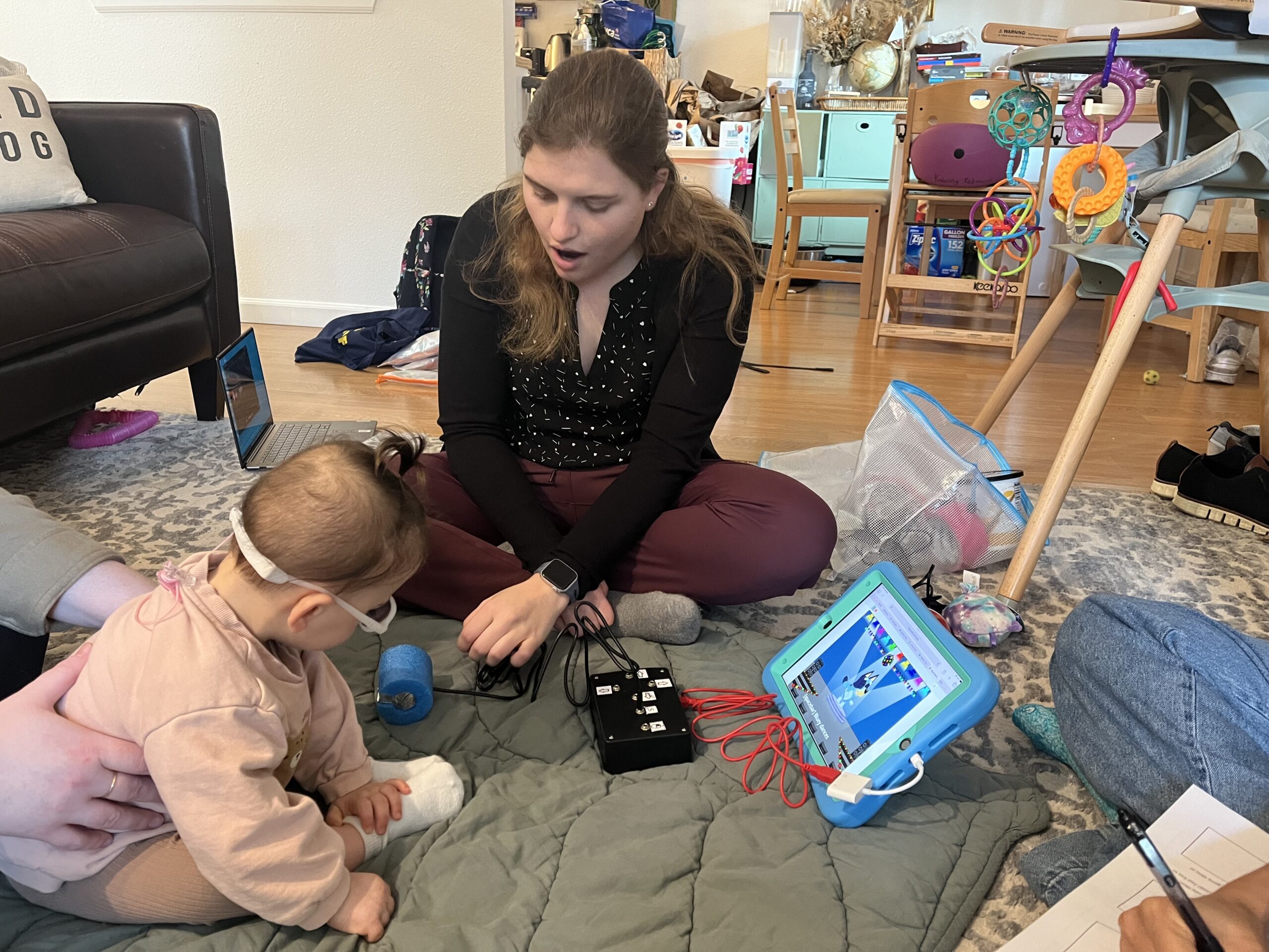Mia Hoffman and a child playing with the switch kit